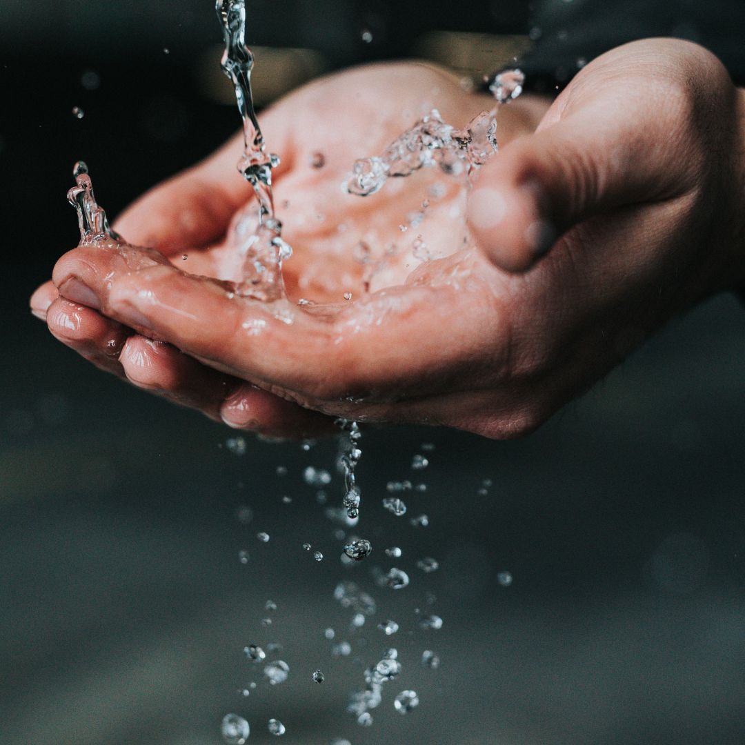 ICV IDEM Public Comment Press Release photo image of two hands outstretched catching clean water from above